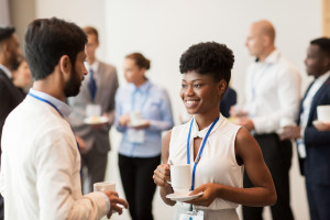 business people with conference badges and coffee